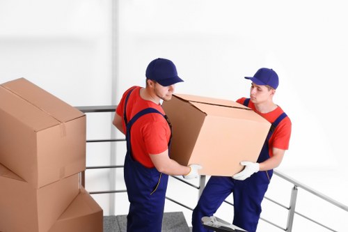 Careful loading of boxes and furniture into a removals van in Swiss Cottage