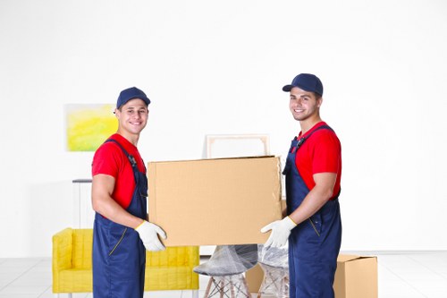 Packed moving boxes and furniture for a Swiss Cottage home move