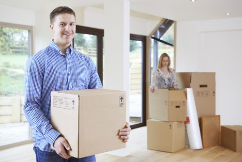 Packed moving boxes and home essentials ready for a Swiss Cottage move