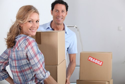 Packed boxes and furniture prepared for a house move in Swiss Cottage