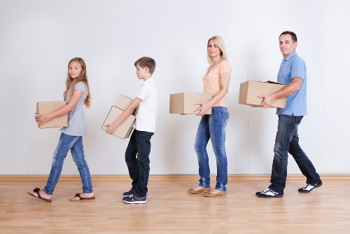 Packed moving boxes and furniture ready for transport