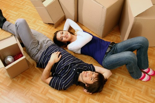 Local movers handling boxes and furniture for a Swiss Cottage move